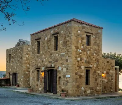 a large stone building with a window at Stay in Falassarna Villas in Falasarna