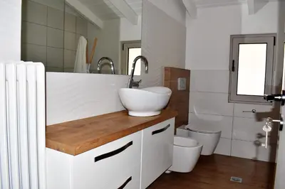 a bathroom with a sink and a toilet at The Well in Chania Town