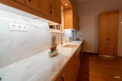 a kitchen with a counter with a pineapple on it at Bitsakis Family I - Paleochora Luxury House in Palaiochóra
