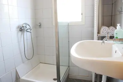 a bathroom with a shower and a sink at house in the village near the sea in Maleme