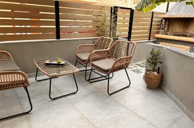 a group of chairs and a table on a patio at Evis House in Chania Town