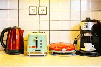 a kitchen counter with two toasters and a coffee maker at Chanialiving Venetian Luxury House-near Plaza Parking in Chania Town