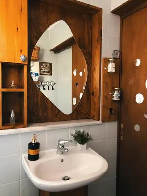 a bathroom with a sink and a mirror at Elia's House Traditional & Cozy by 8essentially in Kalyves
