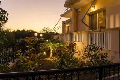 a garden in front of a house at night at Villa Aretaki in Kalamaki Chanion