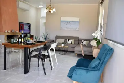 a living room with a table and a couch at House near Balos in Kissamos in Kissamos