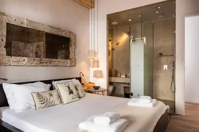 a bedroom with a bed with two towels on it at Domus Aqua in Kato Daratso