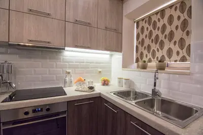 a kitchen with a sink and a counter top at Pasiphae New Apartment sea & city in Chania Town