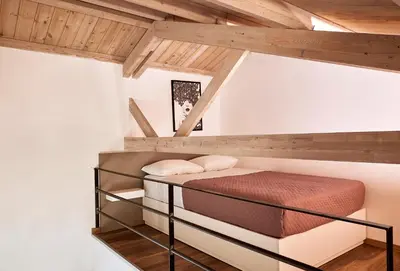 a bedroom with a bunk bed in a attic at Villa Fuerte & Weddings Estate in Alikianós