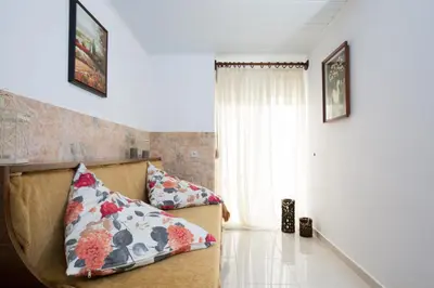 a living room with a couch and a window at Kiki's House near Falassarna and Balos in Plátanos