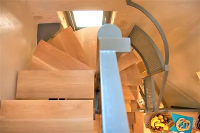 a spiral staircase in a tiny house at The Journey Design Home Chania in Chania Town