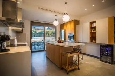 a kitchen with a large island in the middle at Villa Aori in Kariá