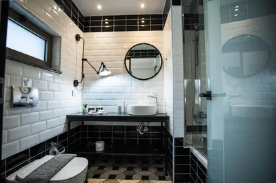 a bathroom with a toilet and a sink and a mirror at Villa Aori in Kariá