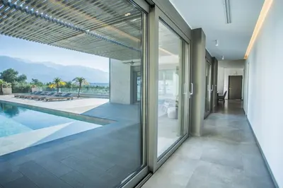 an external view of a house with a swimming pool at Villa Aori in Kariá