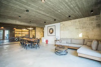 a living room with a couch and a table at Villa Aori in Kariá