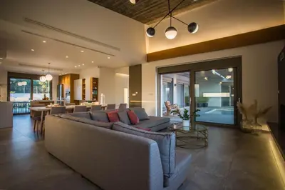 a living room with a couch and a table at Villa Aori in Kariá