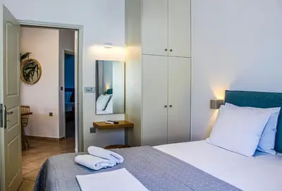 a bedroom with a bed with two towels on it at Endless Blue in Palaiochóra