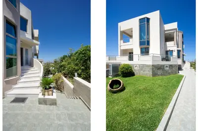 a white house with a green lawn next to it at Alexandra Apartment in Daratso