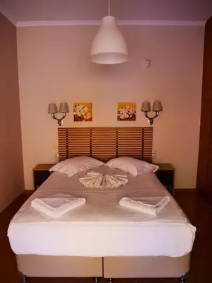 a bedroom with a bed with two towels on it at Cosy Apartments Daphne in Daratso