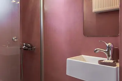 a bathroom with a sink and a shower at YaChara Villa in Kissamos