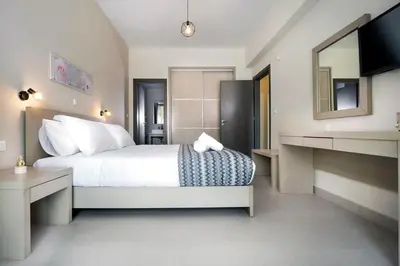 a hotel room with a bed and a mirror at Ellie Apartment in Daratso