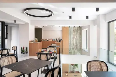 a dining room with a table and chairs at M City Hotel in Chania Town