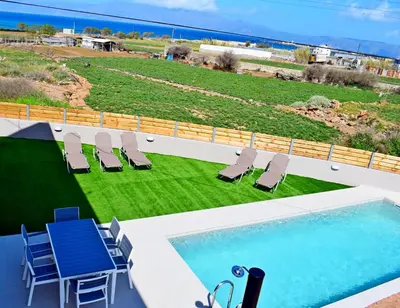 a swimming pool on the roof of a house at Balos Residence private pool Seafront Seaview in Kissamos
