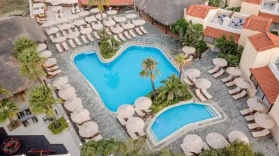 an overhead view of a swimming pool with umbrellas and chairs at Eurohotel Theo Hotel in Agia Marina Nea Kydonias