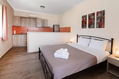 a bedroom with a bed with two towels on it at Dream Sea House villa Falassarna in Falasarna