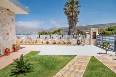 a house with a patio with a view of the ocean at Dream Sea House villa Falassarna in Falasarna