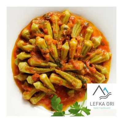 a plate of pasta with tomato sauce and green beans at Lefka Ori in Khóra Sfakíon