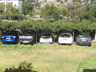a group of cars parked in a parking lot at CAPTAIN GEORGE in Sougia