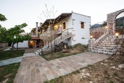 a house with a staircase in front of it at ARADENA TRADITIONAL House 1 in Arádhaina