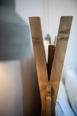 a wooden letter v sitting on a table at Artemide city places-Cozy Rooms in Chania Town