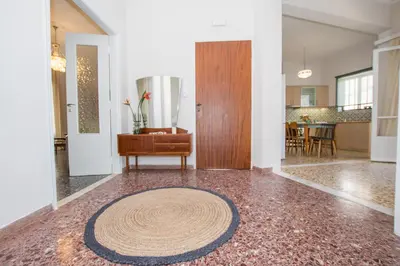 a living room with a rug on the floor at The Romantic Beach House in Chania Town