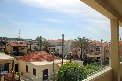 a view of a city from a balcony at Effi Apartments in Plataniás