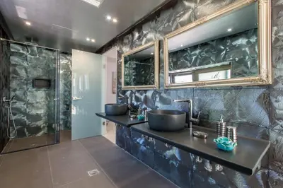a bathroom with two sinks and a shower at Villa Kounoupidiana in Kounoupidhianá