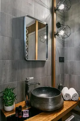 a bathroom with a sink and a mirror at Olvini Villa in Galatás