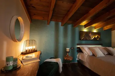 a bedroom with a bed and a table with a lamp at Olvini Villa in Galatás
