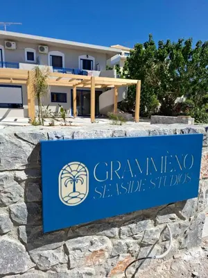 a sign in front of a building at Grammeno Seaside Studios in Palaiochóra