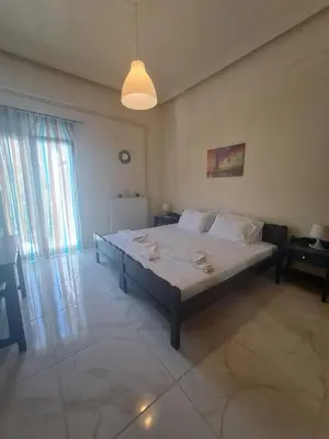 a bedroom with a large bed in a room at Chania Dream Home in Chania Town