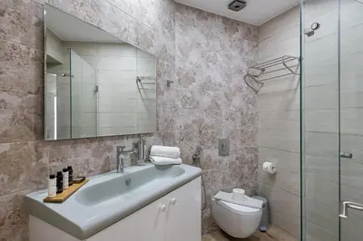 a bathroom with a sink and a toilet at Magnolia Luxury Apartments in Falasarna