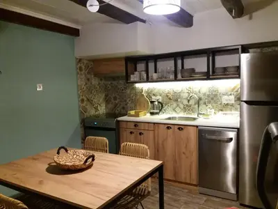 a kitchen with a table with a basket on it at Fivos Residence in Chania Town