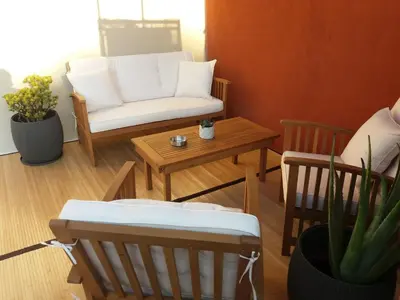 a living room with a couch and a table at Fivos Residence in Chania Town