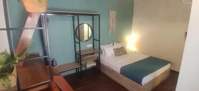 a small bedroom with a bed and a mirror at Fivos Residence in Chania Town