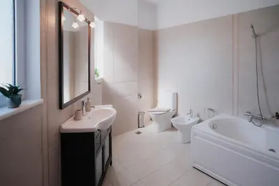 a bathroom with a sink and a tub and a toilet at Sweven Villa Private Pool & Absolute Privacy , Stunning Sunsets in Souda