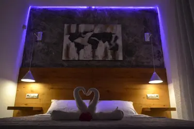 a bedroom with a bed with a heart sign on it at Paraskevi's Apartments in Kissamos