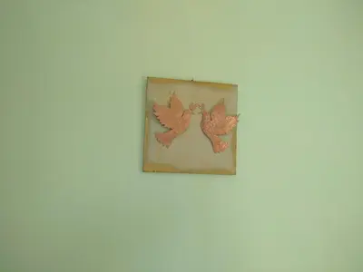 a picture of two birds on a wall at OLIVE BREEZE in Kissamos