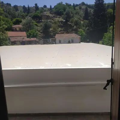 a view from a window of a roof at Therisso Rooms in Thérison
