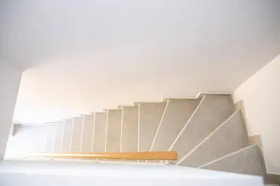 a staircase in a room with a stair case at MOS Luxury City Suites - The Loft in Chania Town