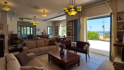 a living room with a couch and a table at Villa 